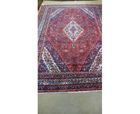 A red ground handmade Persian Sarouk carpet - 3.60m x 2.60m 