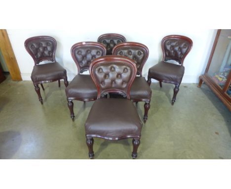 A set of six 19th century mahogany balloon back dining chairs upholstered in button back brown leather
