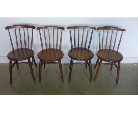 A near set of four penny seat stick back Windsor chairs