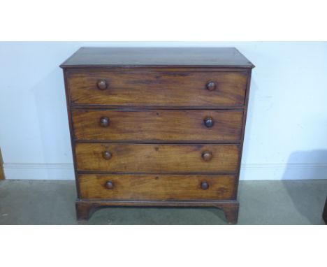 A Regency mahogany chest of four drawers with turned handles on bracket feet - 110cm x 110cm x 55cm