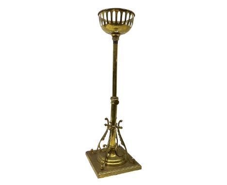 Victorian brass telescopic oil standard lamp, raised upon four scrolling feet of stylised feather form upon stepped square ba