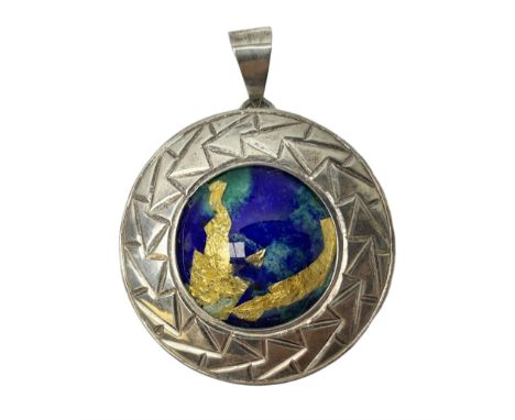 Silver pendant, with a green/green enamel centre with gold leaf detail