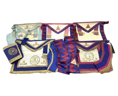 Two Masonic kid leather aprons, one with sash and cuffs, the other with sash, each marked 'Yorkshire North and East Ridings';