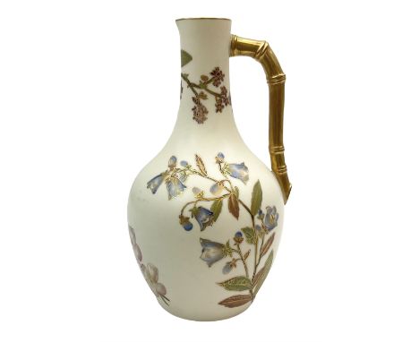 Late 19th century Royal Worcester blush ivory ewer decorated with floral sprays and gilt, with angled bamboo handle, artist m