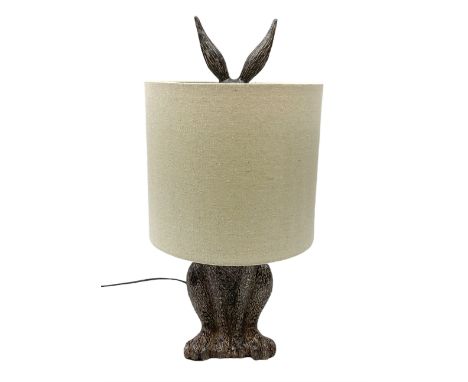 Composite table lamp, modelled as a hare with natural linen shade, H50cmDimensions: Height:&nbsp;50cm&nbsp; Length/Width:&nbs