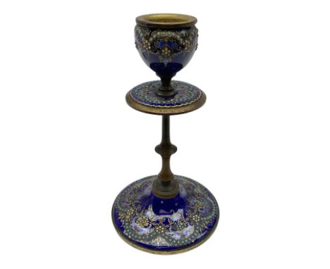 French enamelled candlestick, with floral decoration and gilt detail upon a blue ground, H14cm