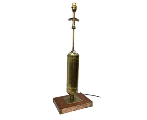Repurposed lamp modelled from a mid-century brass Pyrene fire extinguisher, on rectangular wood base with copper and brass ed