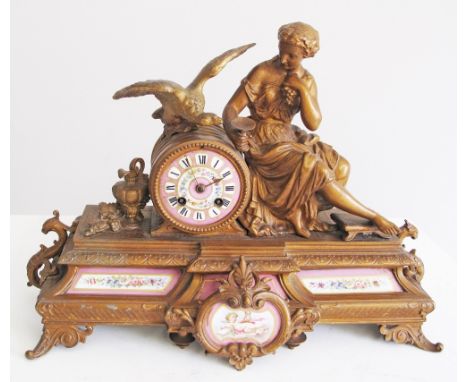 A French ormolu mantel clock with eight day movement striking on a bell, painted pink porcelain dial with floral decoration, 