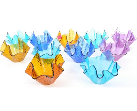 A collection of vintage 20th century English pressed coloured glass handkerchief vases. Each measuring approx. 10cm tall.