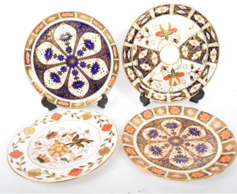 English Royal Crown Derby. Set of four vintage 20th Century Imari display china plates. In the typical gilt and repeating geo