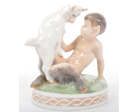 Royal Copenhagen - A 20th century Royal Copenhagen bone china figurine in the form of a satyr / pan sat upon grass with goat.