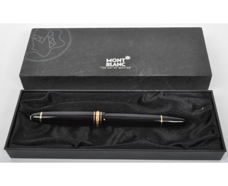 A Mont Blanc Meisterstuck fountain pen, in black, with a 14 carat gold nib, being complete with a Mont Blanc case having pape