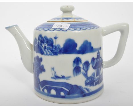 An 18th Century Chinese blue &amp; white porcelain teapot. Handle to rear with finial lid to top and decoration of an Asian l