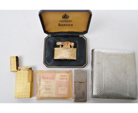 A collection of three 20th century cigarette lighters to include a gold plated Dunhill lighter with engine turned decoration,