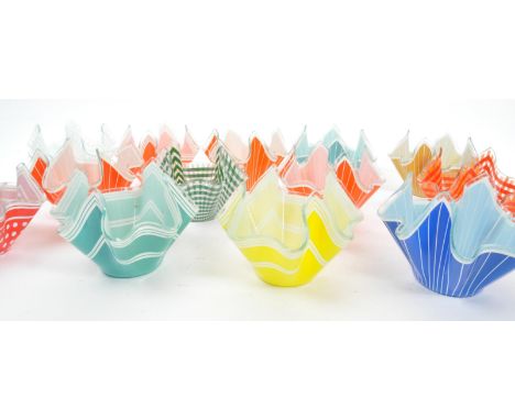 A collection of vintage 20th century English glass handkerchief vases decorated with polychrome printed geometric patterns. E