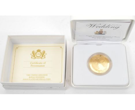 The Royal Mint - A 925 sterling silver 22ct gold plated £5 coin commemorating 2011 Royal Wedding of Prince William Arthur Phi