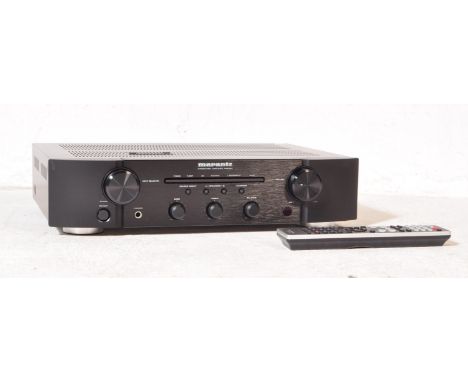 A retro vintage 20th century Marantz PM6004&nbsp;integrated amplifier in original cardboard box. Black colourway with remote 