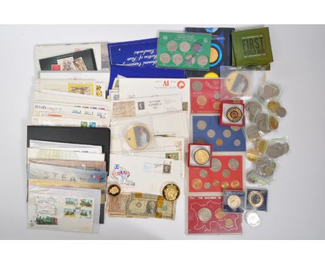 A large collection of vintage 20th century commemorative coins &amp; UK currency franked &amp; unfranked stamps. The lot to i