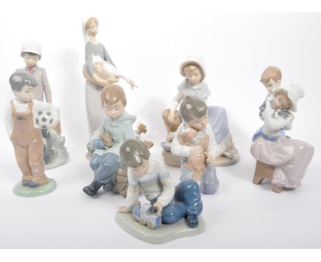 Collection of Nao Spanish porcelain figurines to include boy with rabbit, boy and dog at tree stump, boy with train, girl wit