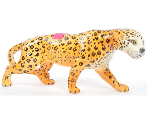 Beswick - A vintage 20th century Beswick bone china leopard figure modelled in prowling position. Model no. 1082. Measures 29