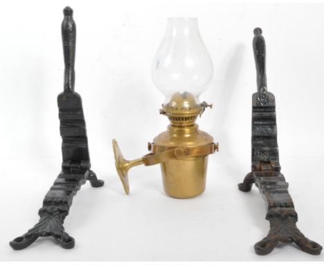 An early 20th century marine ships bulkhead oil lamp on swivel frame together with a pair of 19th century Victorian cast iron