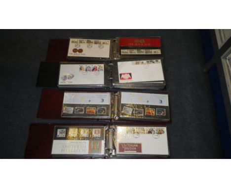 A collection of four first day cover and presentation pack albums