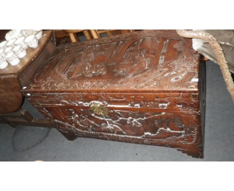 A CARVED CAMPHOR WOOD TRUNK, 40" wide