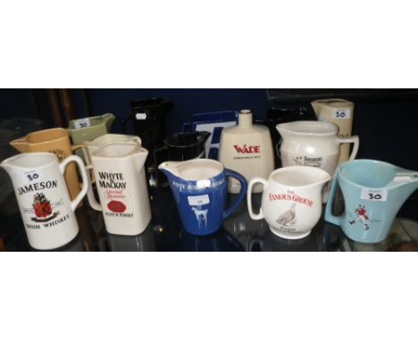 A collection of Vintage pub advertising water jugs, to include a Wade Johnny Walker jug, Black & White Whisky and Worthington