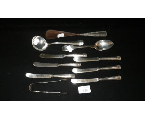 A silver sauce ladle, a pair of silver sugar tongs, a silver handled shoe horn and other items