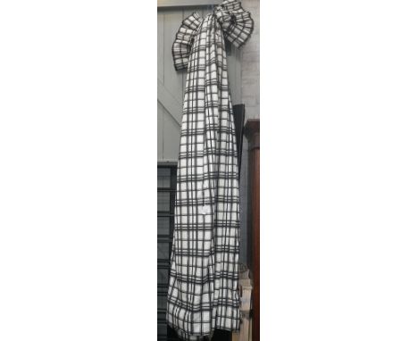 A pair of full-length lined cotton curtains with a black and white check design and black button detail to head (Approx 96" d