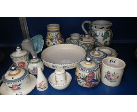 A collection of Poole Pottery to include jam pots, condiment sets and other items