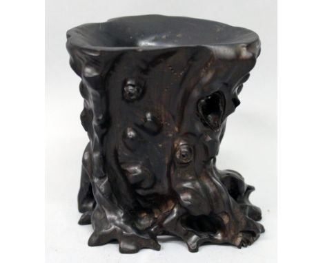 A CHINESE WOOD BRUSH POT, modelled in the form of a knarled tree trunk, 5in high & 4.5in wide at widest point.
