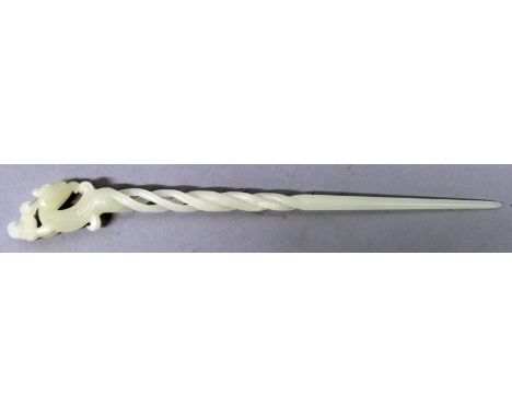A CHINESE WHITE JADE-LIKE TRIPLE TWIST HAIR PIN, the tapering stem surmounted by a dragon, 9.5in long.