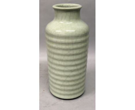 A CHINESE CELADON RIBBED CYLINDRICAL CRACKLEGLAZE PORCELAIN VASE, the base with a Yongzheng seal mark, 9.9in high.