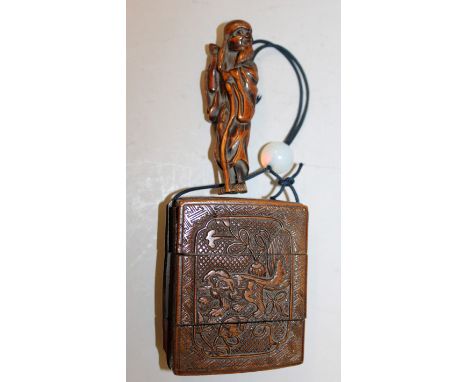 A GOOD JAPANESE EDO/MEIJI PERIOD CARVED WOOD NETSUKE OF A STANDING SENNIN, clasping a knarled staff, 4in high; together with 