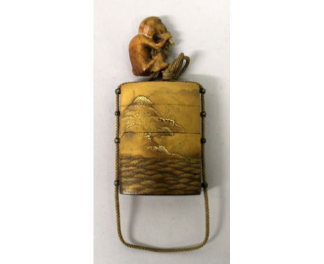 A GOOD QUALITY JAPANESE MEIJI PERIOD THREE CASE GOLD LACQUERED INRO, together with a carved soapstone monkey netsuke, the sid