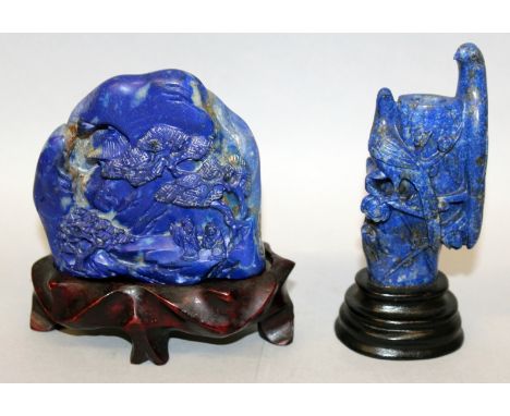 A GOOD 18TH/19TH CENTURY CHINESE LAPIS LAZULI BOULDER, together with a wood stand, the side carved with a scene of two sages 