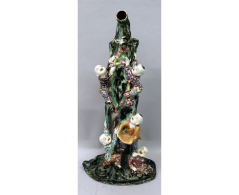 A GOOD UNUSUAL EARLY 20TH CENTURY CHINESE REPUBLIC PERIOD FAMILLE ROSE PORCELAIN MODEL, of boys climbing up a tall tree trunk