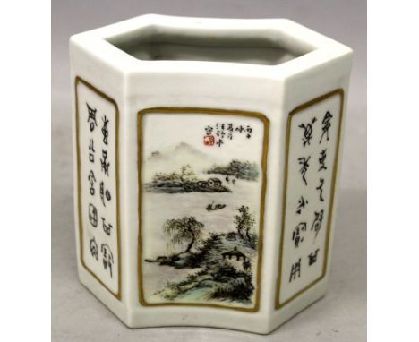 A CHINESE FAMILLE ROSE PORCELAIN BRUSHPOT, of waisted lozenge section, the sides decorated with calligraphy and two river lan