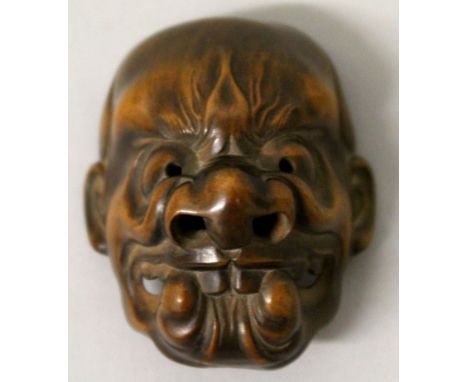 A FINE QUALITY SIGNED JAPANESE MEIJI PERIOD BAMBOO MASK NETSUKE, with demonic features, the underside with engraved kakihan a