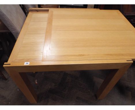 A 3' heavy square light oak dining table with fold over extending top