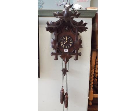 A Black Forest style Cuckoo clock with deer mount