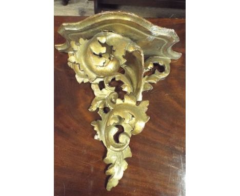 Gilt wood wall bracket in rococo style measuring 28cm wide x 31cm high 