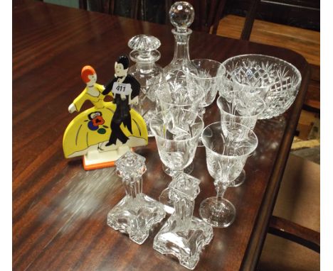 Cut glass ships decanter, one other, fruit bowl, candlesticks, wine glasses and a Clarice Cliff style figure ornament 