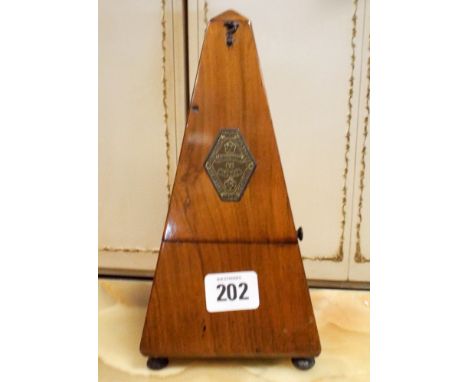 A Metronome in walnut cabinet 