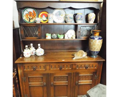 A 4'6 reproduction oak dresser with open shelf and leaded glazed back 