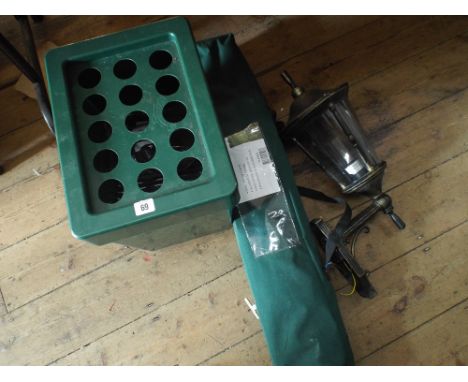 A propagator, an outdoor wall lantern and a fold up chair  