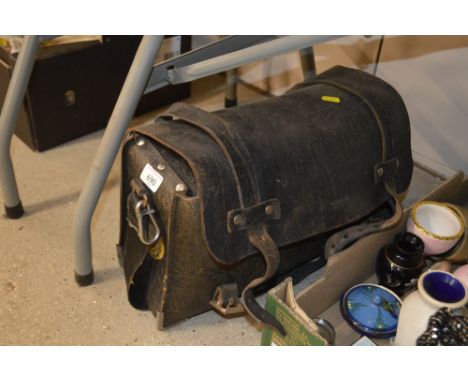 A leather bag containing a railway relating cap; enameled flask etc.