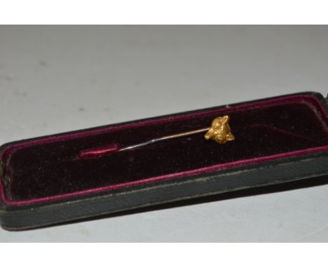 A stick pin in the form of a fox 