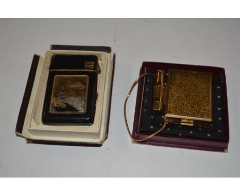 A gold plated compact; together with an oriental lighter